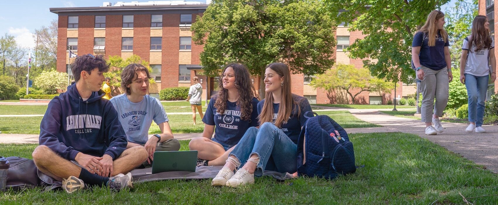 LVC students sit on social quad in spring