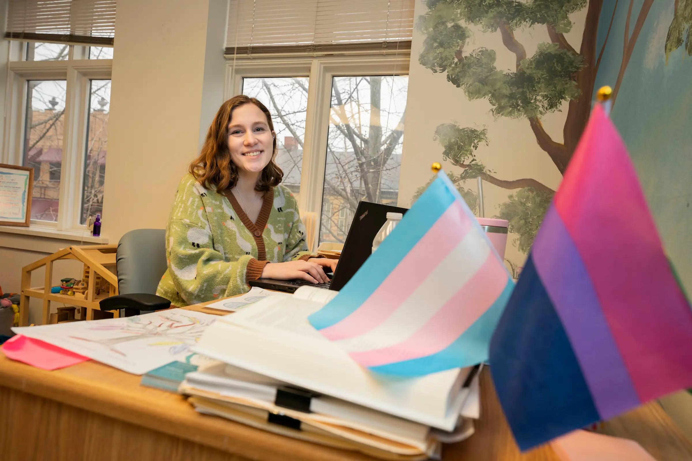 Julia Wecker sits at desk